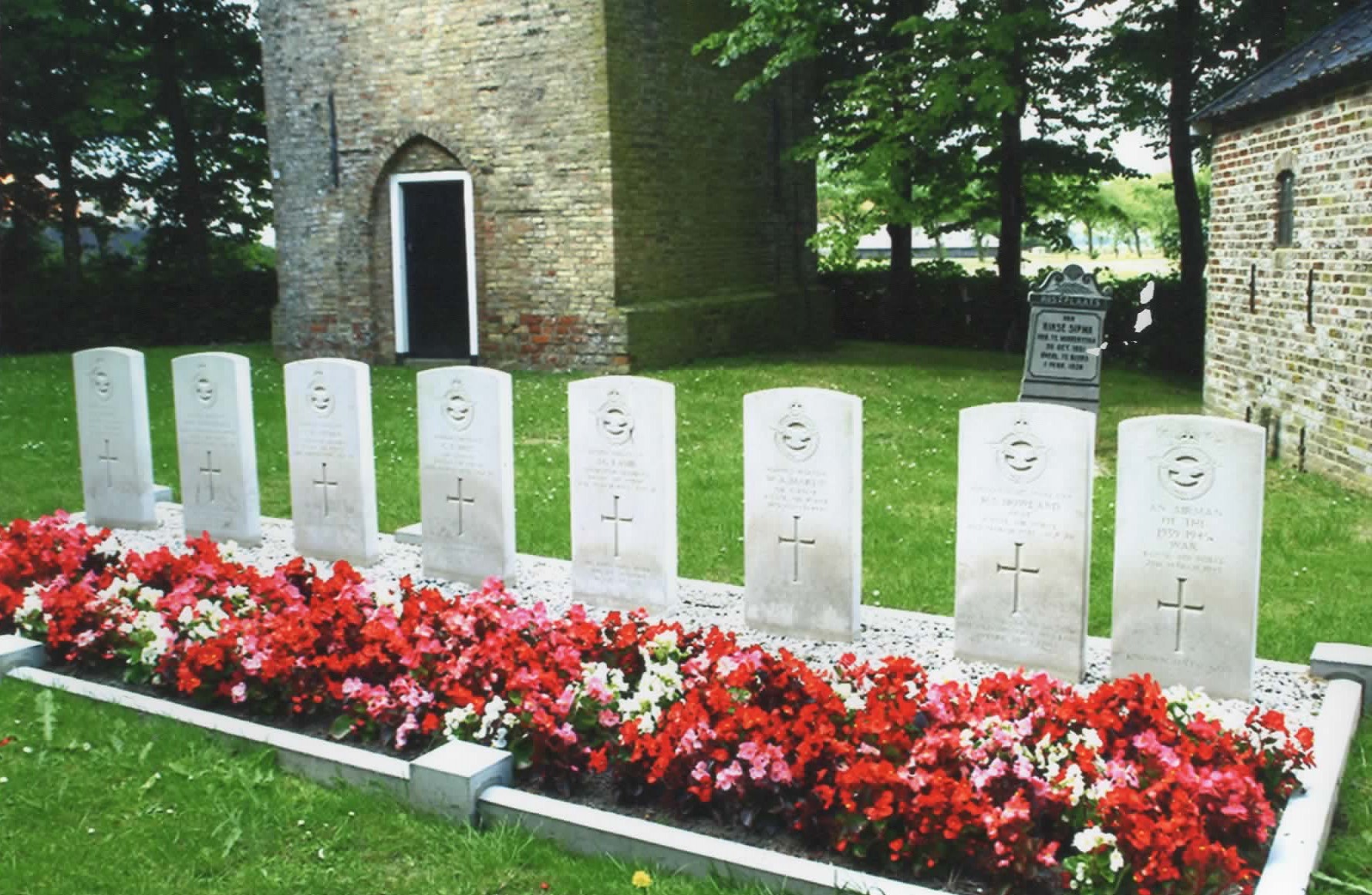 The crew of Stirling 'T for Tommy' lie side by side at Schillaard.