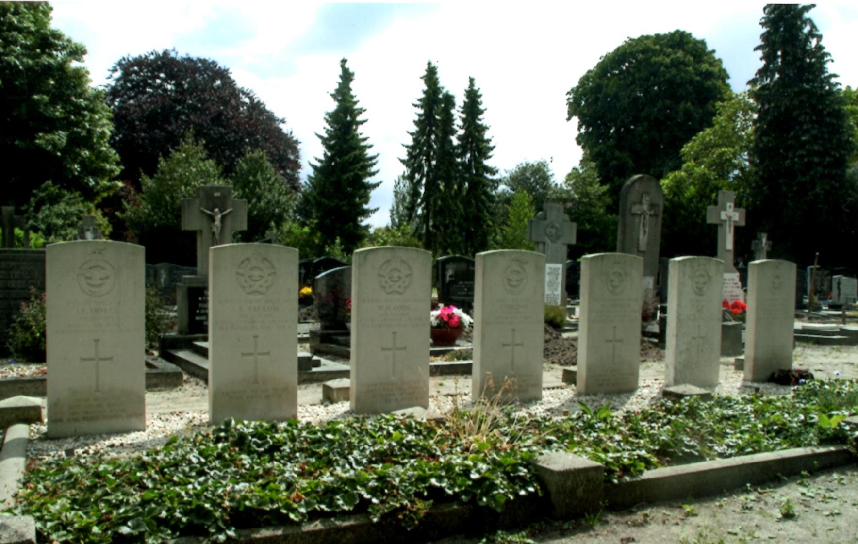 The graves of the seven Lancaster crew at Westerbeek, side by side.